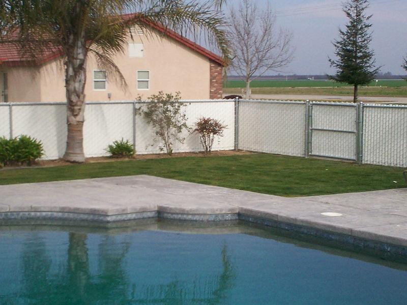 Swimming pool with wood fence — Wood Fences in Bakersfield, CA