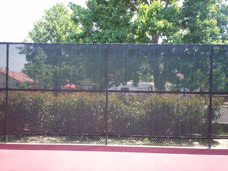 Front view of chainlink fence in tennis court — Wood Fences in Bakersfield, CA