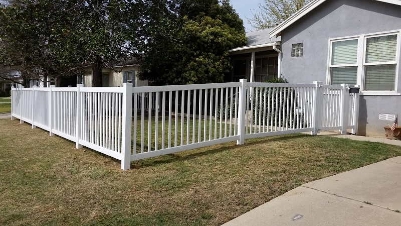 House with white wood fence — Wood Fences in Bakersfield, CA