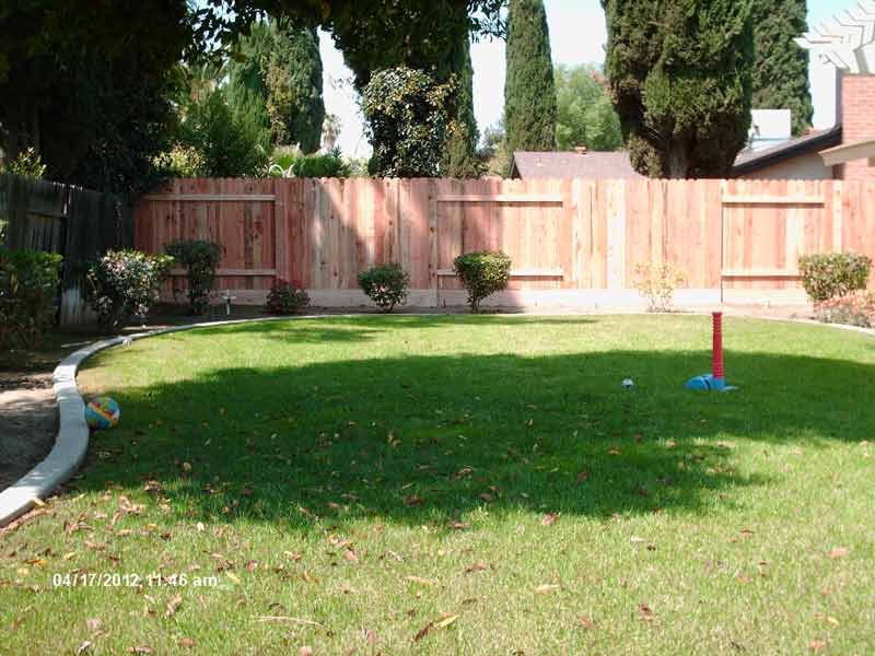 Garden with wood fences — Wood Fences in Bakersfield, CA