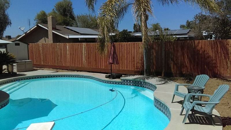 Swimming pool with fences— Wood Fences in Bakersfield, CA