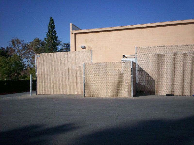 Brown chainlink fence— Wood Fences in Bakersfield, CA