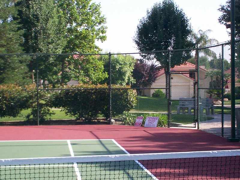 Chainlink fence in tennis court — Wood Fences in Bakersfield, CA