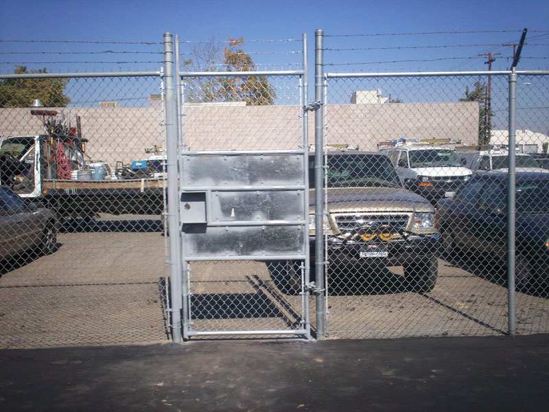 Garage with chainlink fence — Wood Fences in Bakersfield, CA