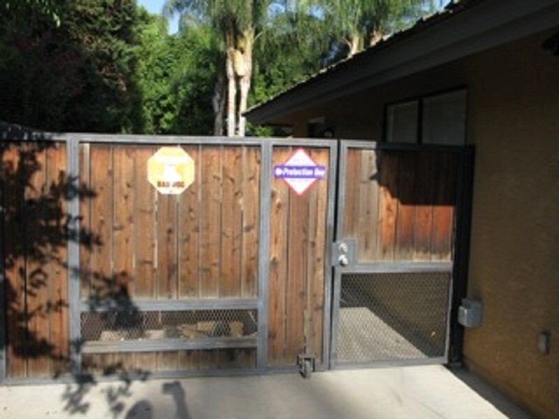 House with wood fence gate — Wood Fences in Bakersfield, CA