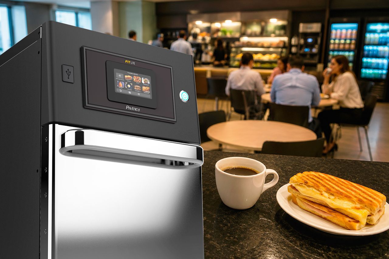 Prática FIT Lite Speed Oven in a modern office canteen, preparing hot sandwiches