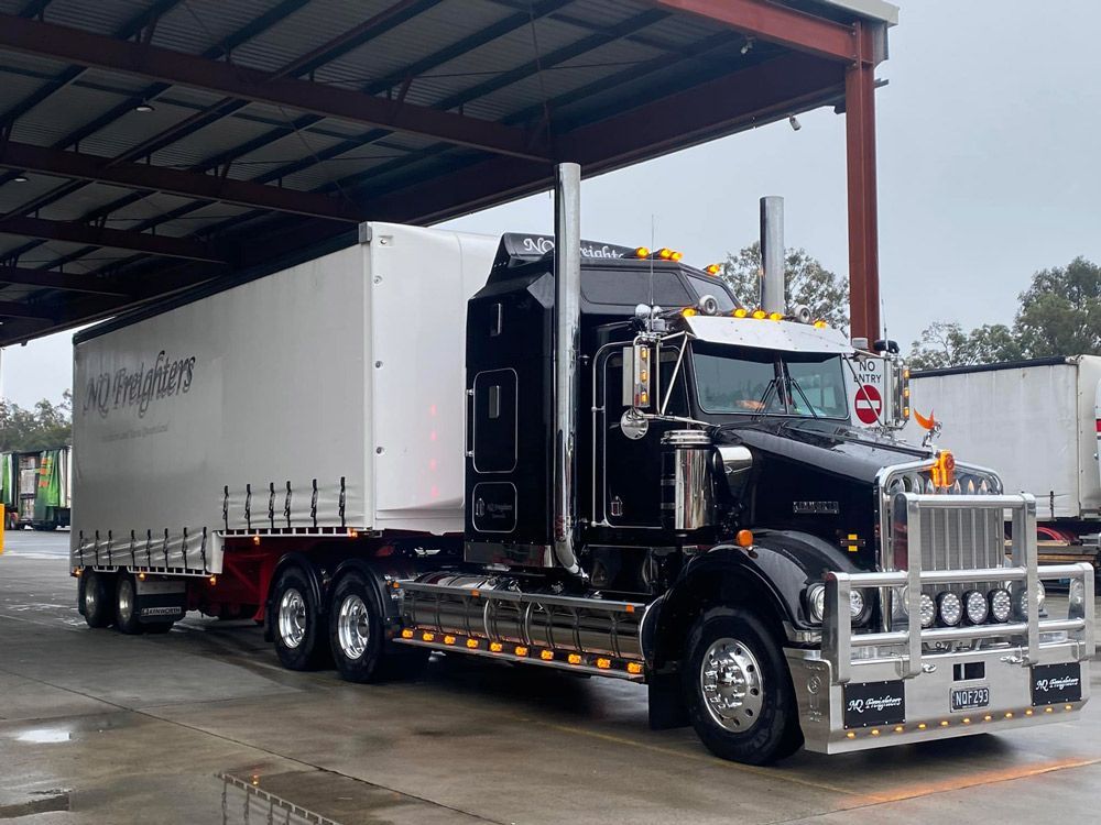 Black Freight Truck With White Container Transport — NQ Freighters In Townsville QLD