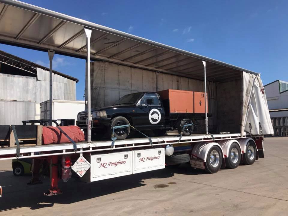 Black Pick Vehicle Loading In The NQ Freighter Truck — NQ Freighters In Bohle QLD