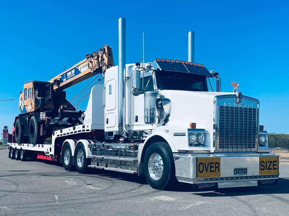 Transporting The Heavy Equipment Using Freight Truck — NQ Freighters In Bohle QLD
