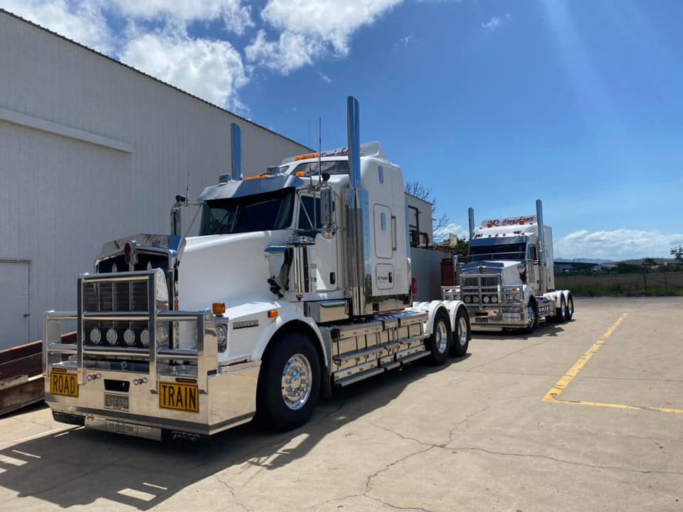 Two Heavy Road Train Trucks Parked — NQ Freighters In Bohle QLD