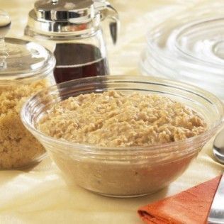 Bowl of oatmeal with syrup and brown sugar.