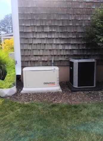 Standby generator installed outside a house.
