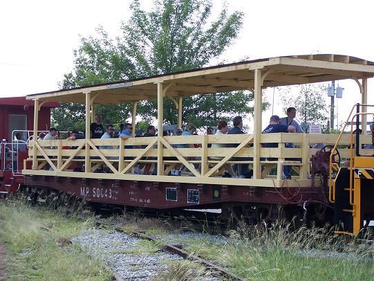 Missouri Pacific flat car 50043 converted to passenger carrier.