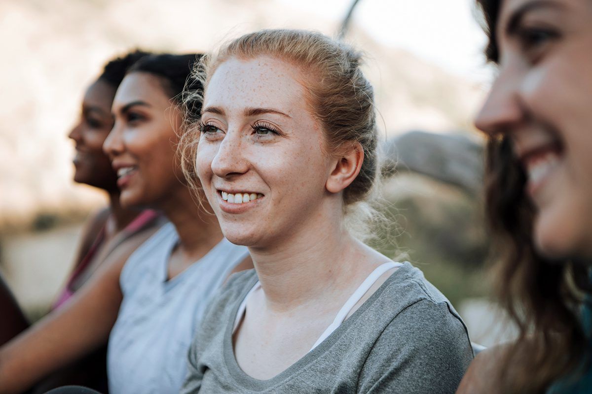 A group of young women smiling.