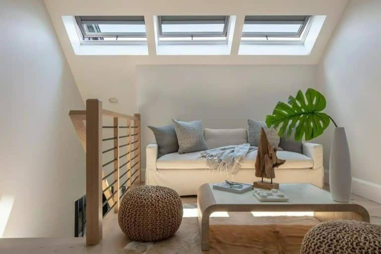 A Living Room With a Couch, Coffee Table, Ottomans and Skylights — Gold Coast Skylights in Slacks Cr