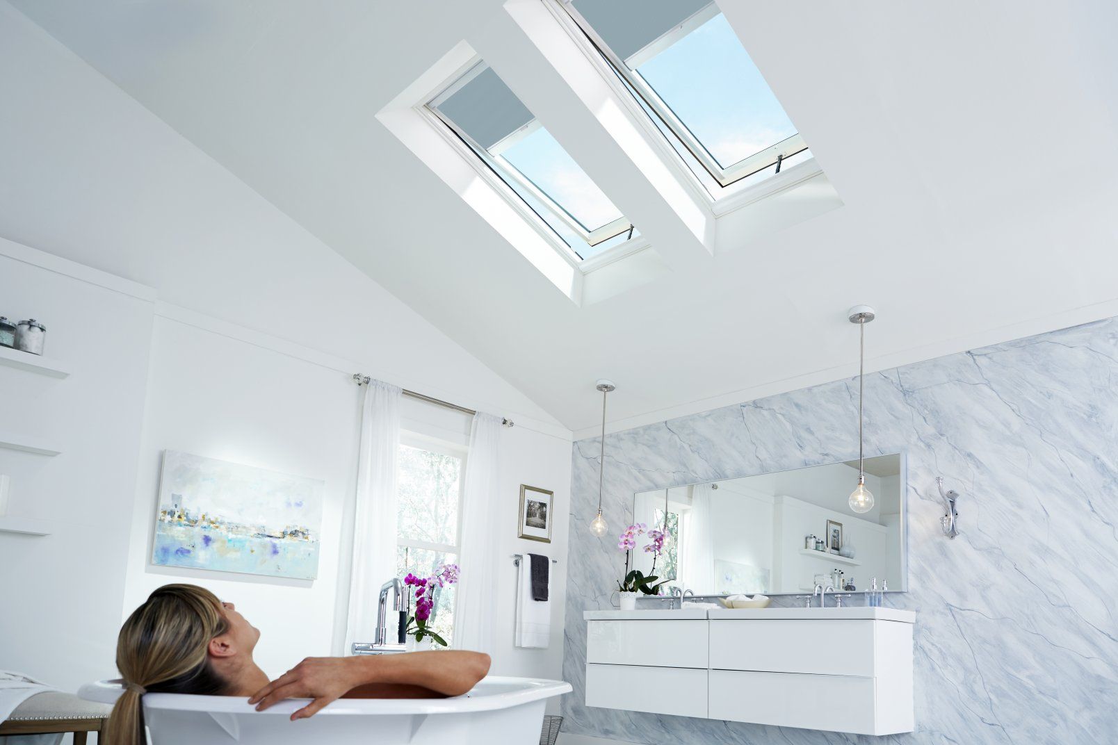 Woman Relaxing in a Bathtub Under Open Skylights in a Bright — Gold Coast Skylights in Slacks Creek, QLD