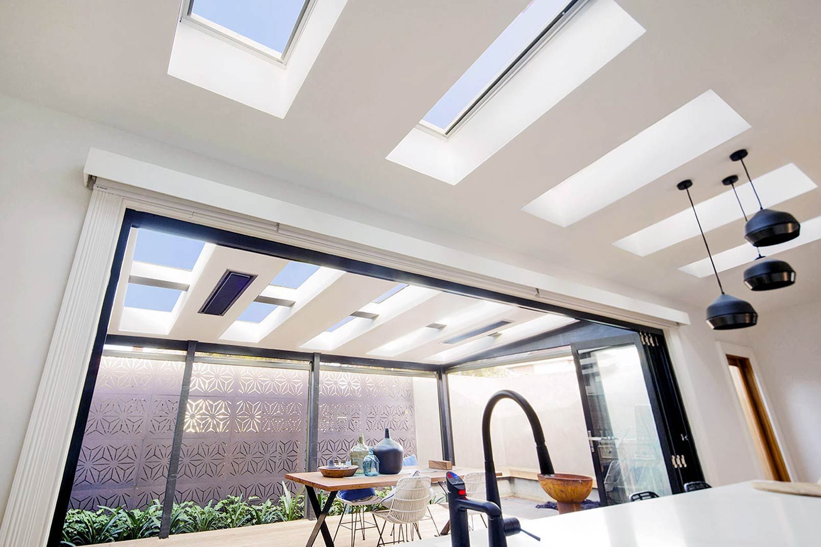 Interior With Several Skylights, a Large Sliding Glass Door to a Patio — Gold Coast Skylights in Slacks Creek, QLD