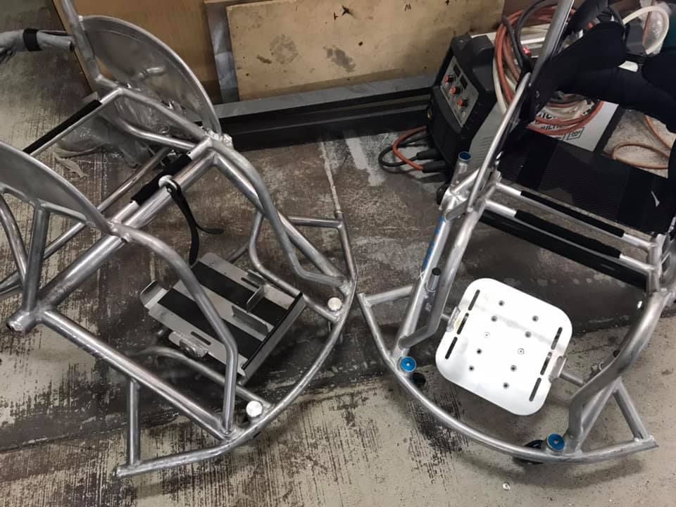 Two Rocking Chairs Are Sitting on the Floor in a Garage — Jensen Welding & Fabrication in Chevallum, QLD