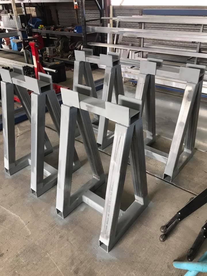 A Row of Metal Frames Sitting on Top of a Concrete Floor — Jensen Welding & Fabrication in Maroochydore, QLD