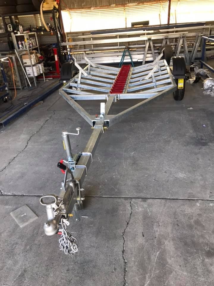 A Trailer is Sitting on the Ground in a Garage — Jensen Welding & Fabrication in Chevallum, QLD