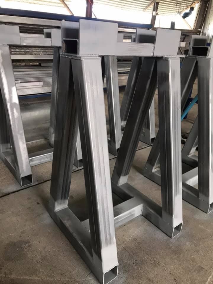 A Row of Metal Frames Sitting on Top of Each Other on a Table — Jensen Welding & Fabrication in Chevallum, QLD