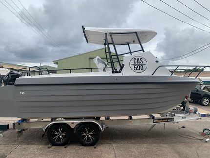 Gray motorboat on a trailer with a white canopy, parked outdoors under cloudy skies.  — Jensen Welding & Fabrication in Chevallum, QLD