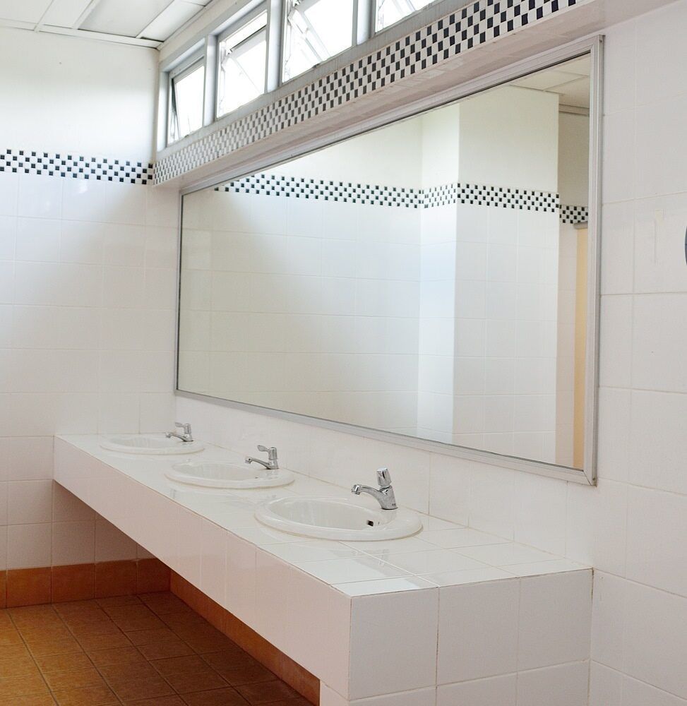 A Bathroom With Three Sinks and a Large Mirror — Jensen Welding & Fabrication in Chevallum, QLD