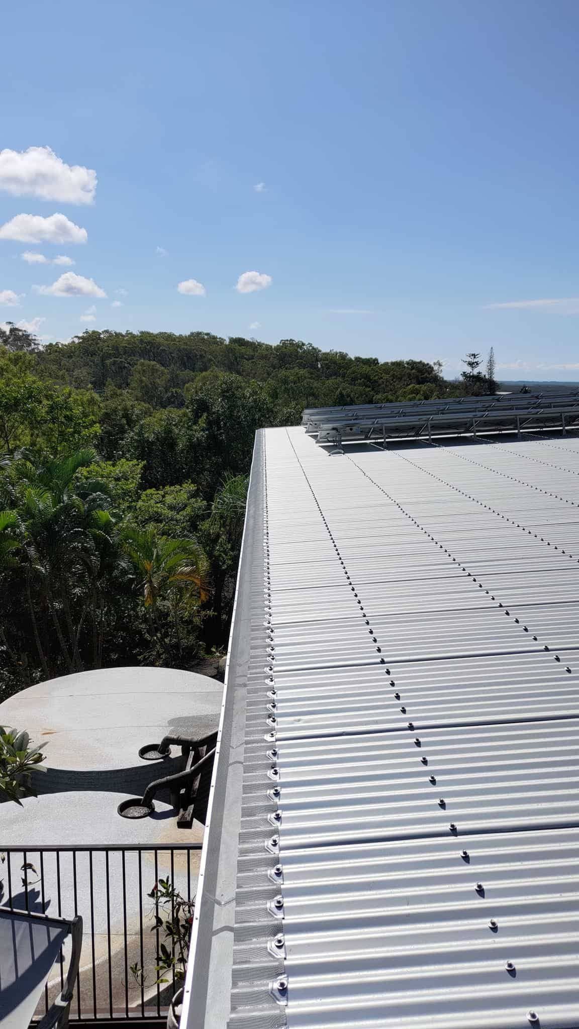On the Top of a Roof with Solar Panels — Roofer in Rockhampton, QLD