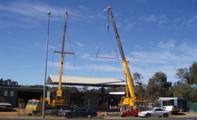 A crane operator in action in South Coast WA