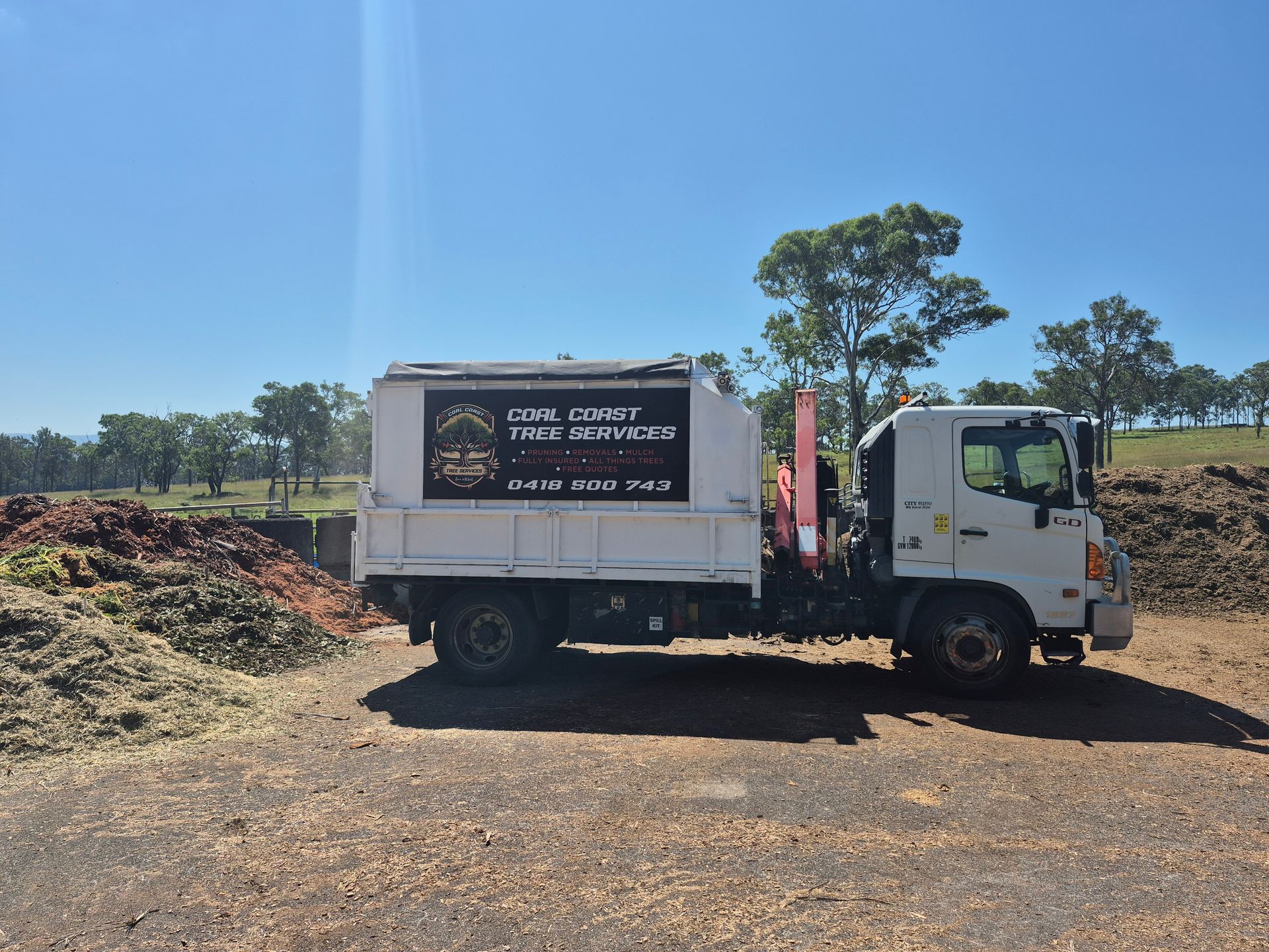 Gold Coast Tree Services truck parked outdoors.