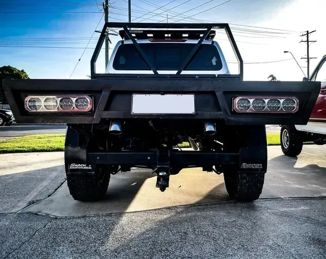 Rear View of a White Pickup Truck — Aitkenvale Exhausts & Towbars Pty Ltd In Aitkenvale, QLD