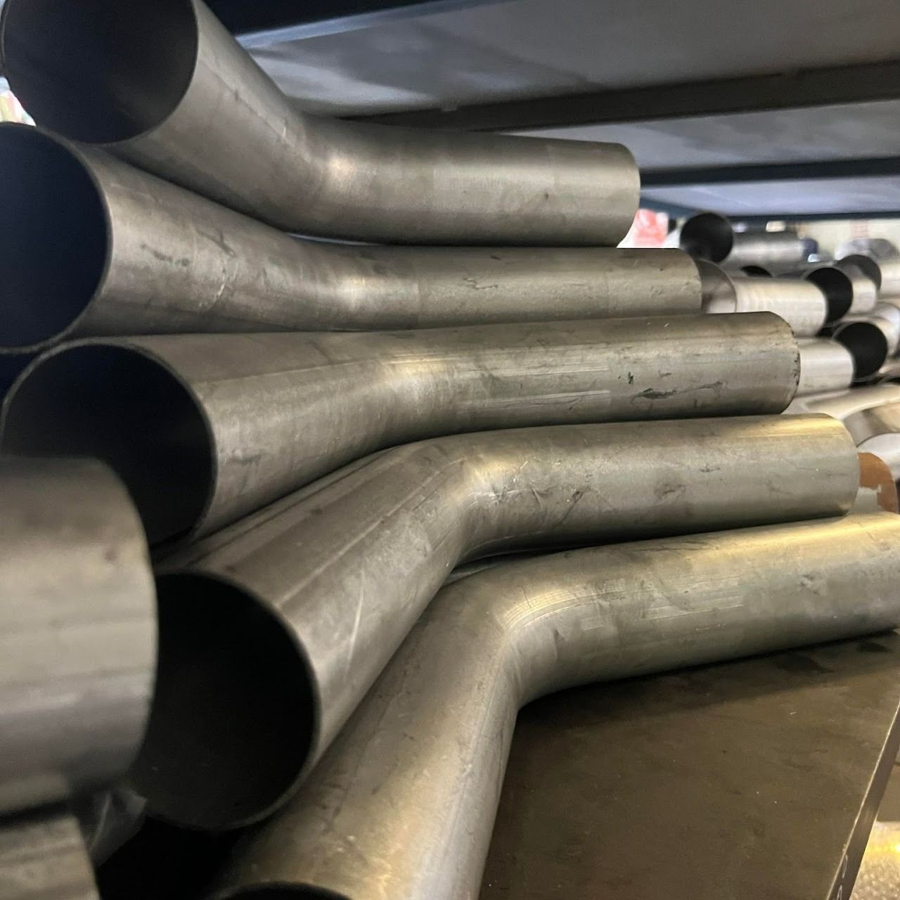 Pile of curved — Aitkenvale Exhausts & Towbars Pty Ltd In Aitkenvale, QLD