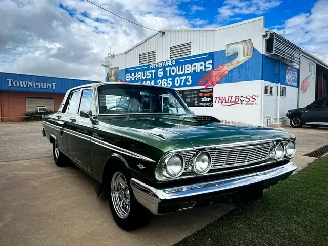 Green Classic Car Parked in Front of a Building — Aitkenvale Exhausts & Towbars Pty Ltd In Aitkenvale, QLD