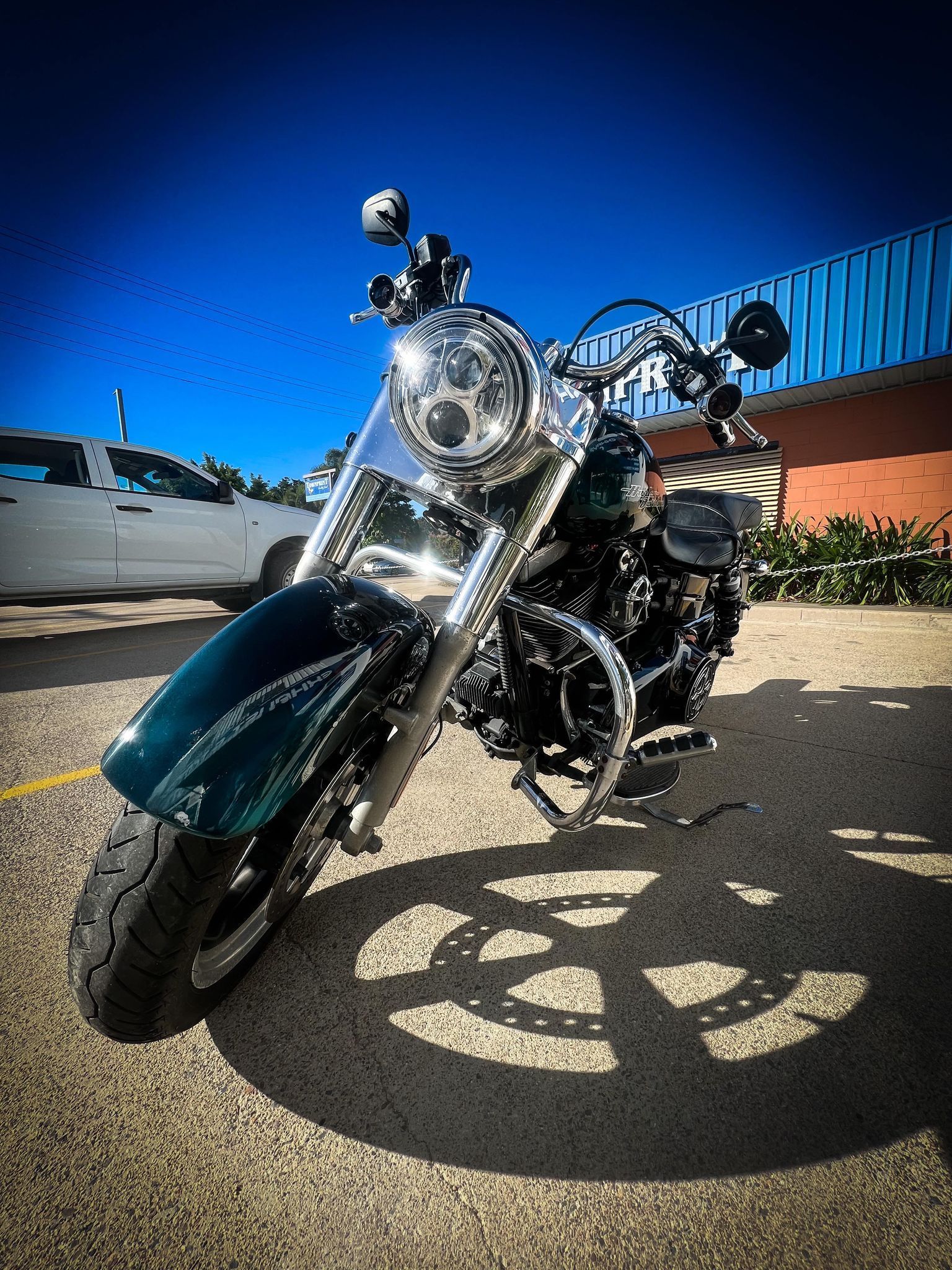 Emerald Motorcycle Parked Outside — Aitkenvale Exhausts & Towbars Pty Ltd In Aitkenvale, QLD