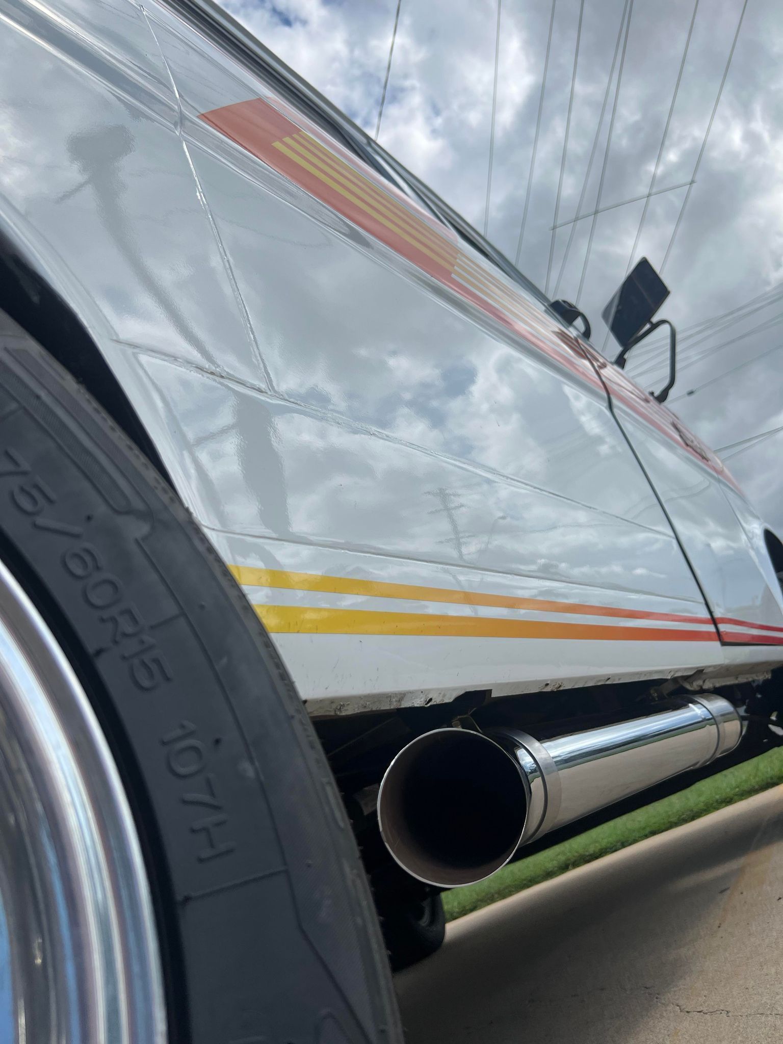 Chrome Exhaust Pipe on a White Classic Car — Aitkenvale Exhausts & Towbars Pty Ltd In Aitkenvale, QLD