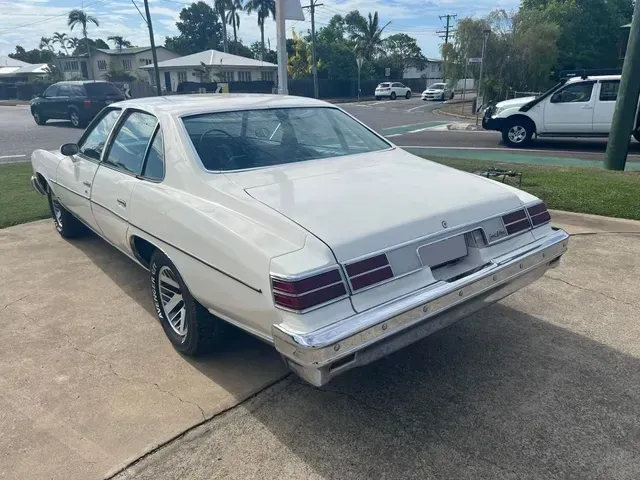 White Classic Sedan Parked on a Paved Lot — Aitkenvale Exhausts & Towbars Pty Ltd In Aitkenvale, QLD