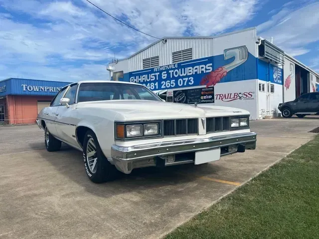 White Vintage Pontiac Car Parked — Aitkenvale Exhausts & Towbars Pty Ltd In Aitkenvale, QLD