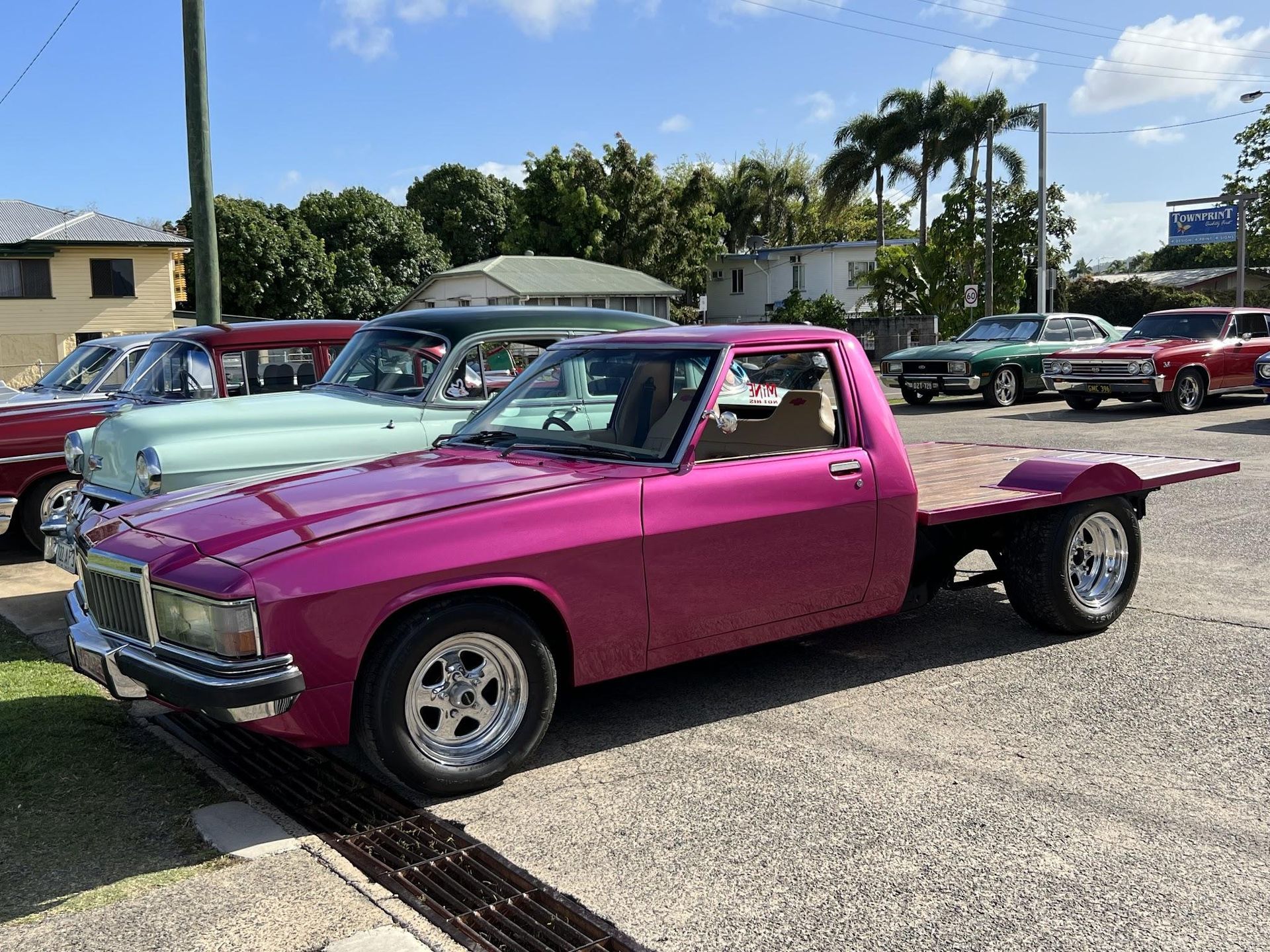 Pink Flatbed Truck Parked Outside — Aitkenvale Exhausts & Towbars Pty Ltd In Aitkenvale, QLD