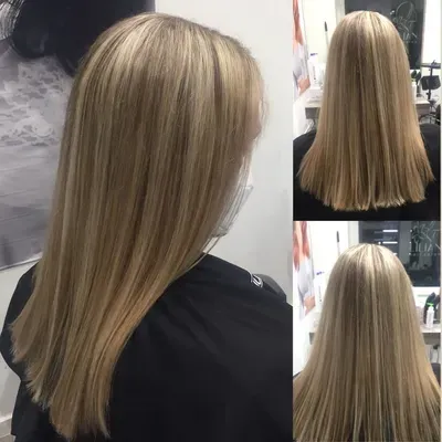 Eine Frau mit langen blonden Haaren trägt ein schwarzes Hemd und eine Maske.