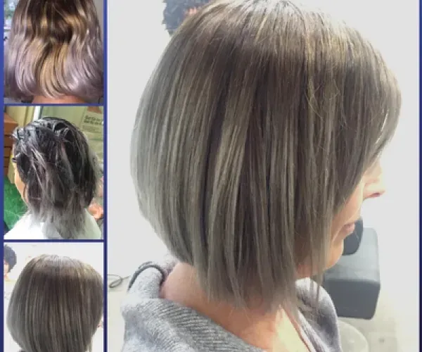 Eine Frau mit kurzen grauen Haaren lässt sich in einem Salon die Haare schneiden.