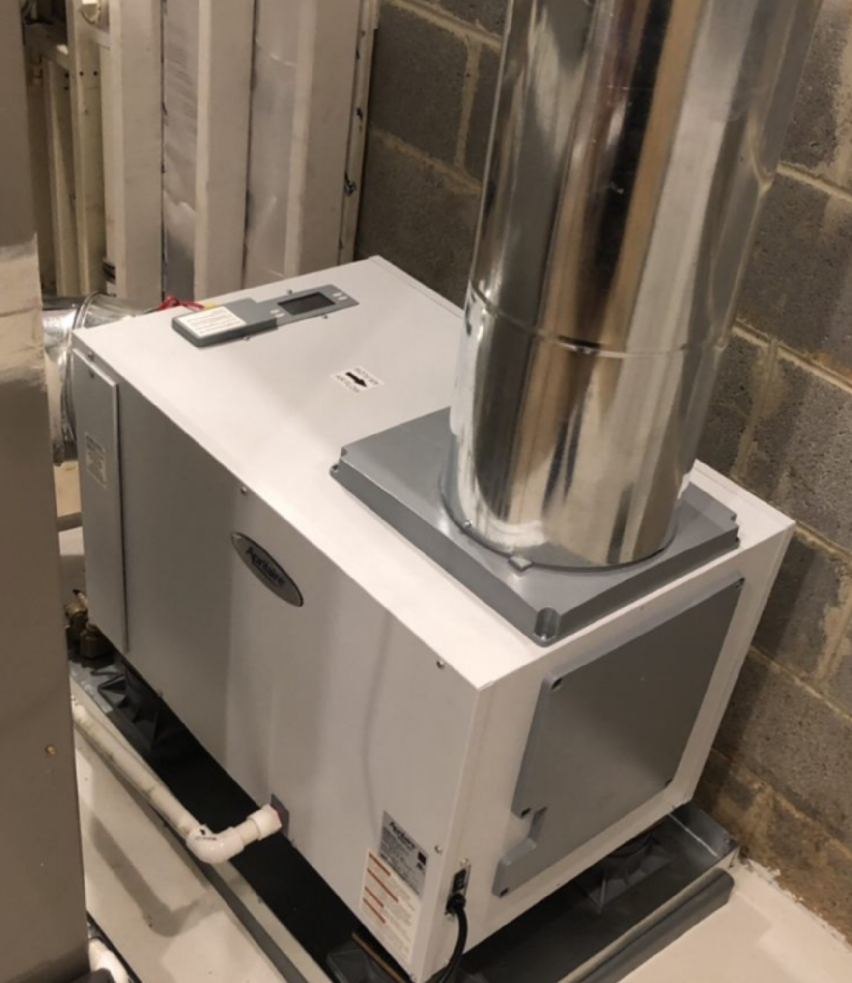 A white box with a metal pipe coming out of it