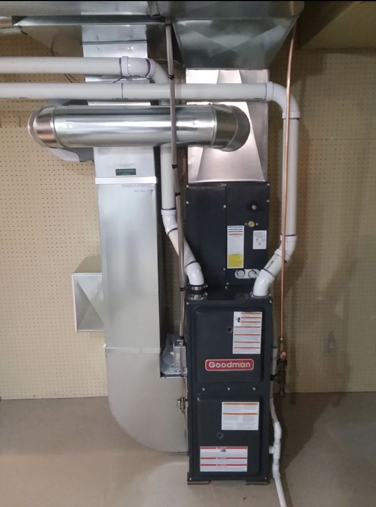 A heating and cooling system is installed in a basement.