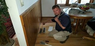 Duct Cleaning — Man Cleaning Floor Heating Vent in Rapid City, SD