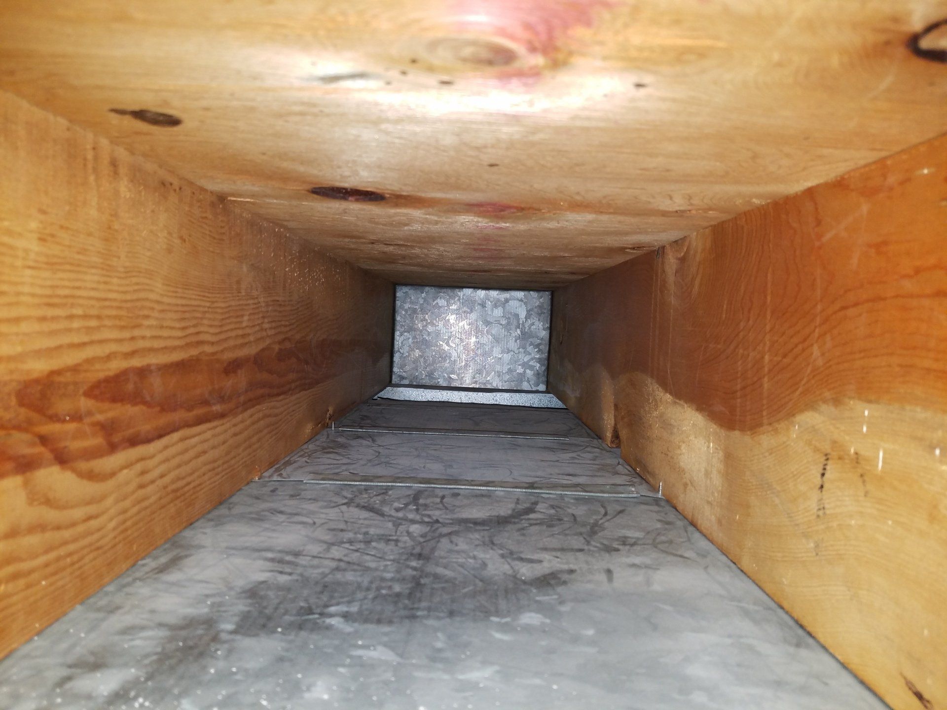 Duct Cleaning — Man Cleaning Floor Heating Vent in Rapid City, SD