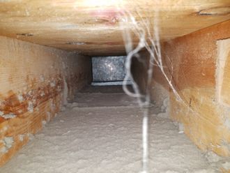Duct Cleaning — Man Cleaning Floor Heating Vent in Rapid City, SD