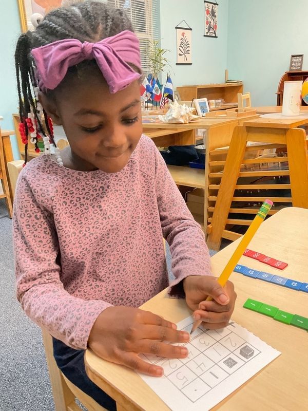 Students helping each other in the classroom