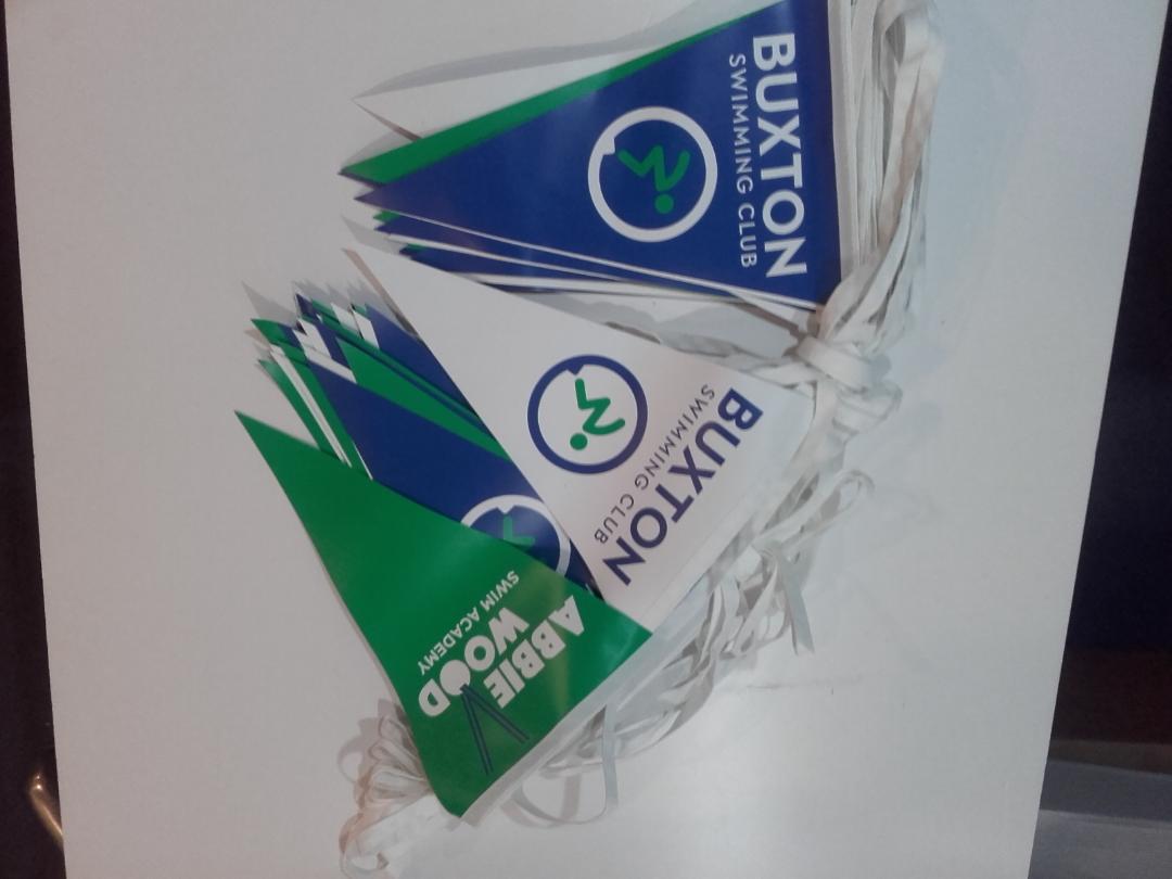 A bunch of flags with buxton written on them