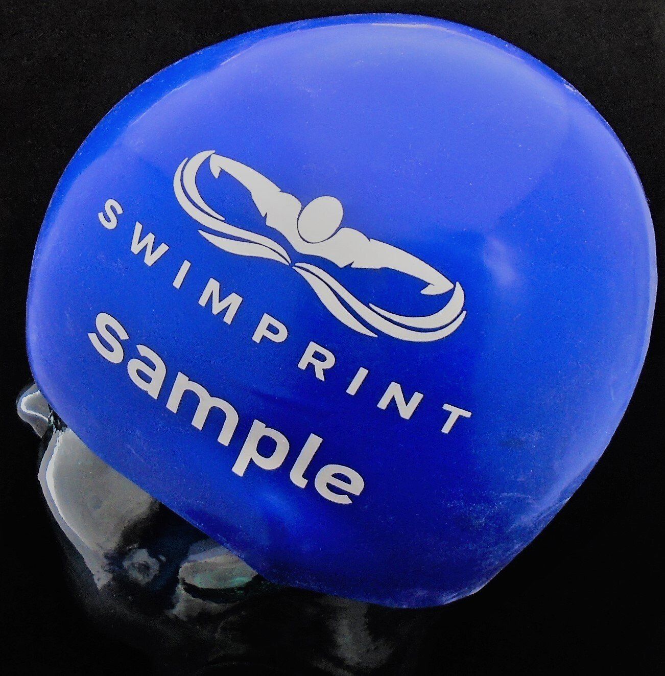 A blue swimming helmet that says swimprint sample on it