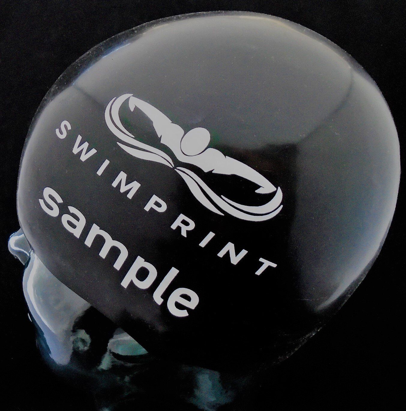 A black helmet with the words swimprint sample on it