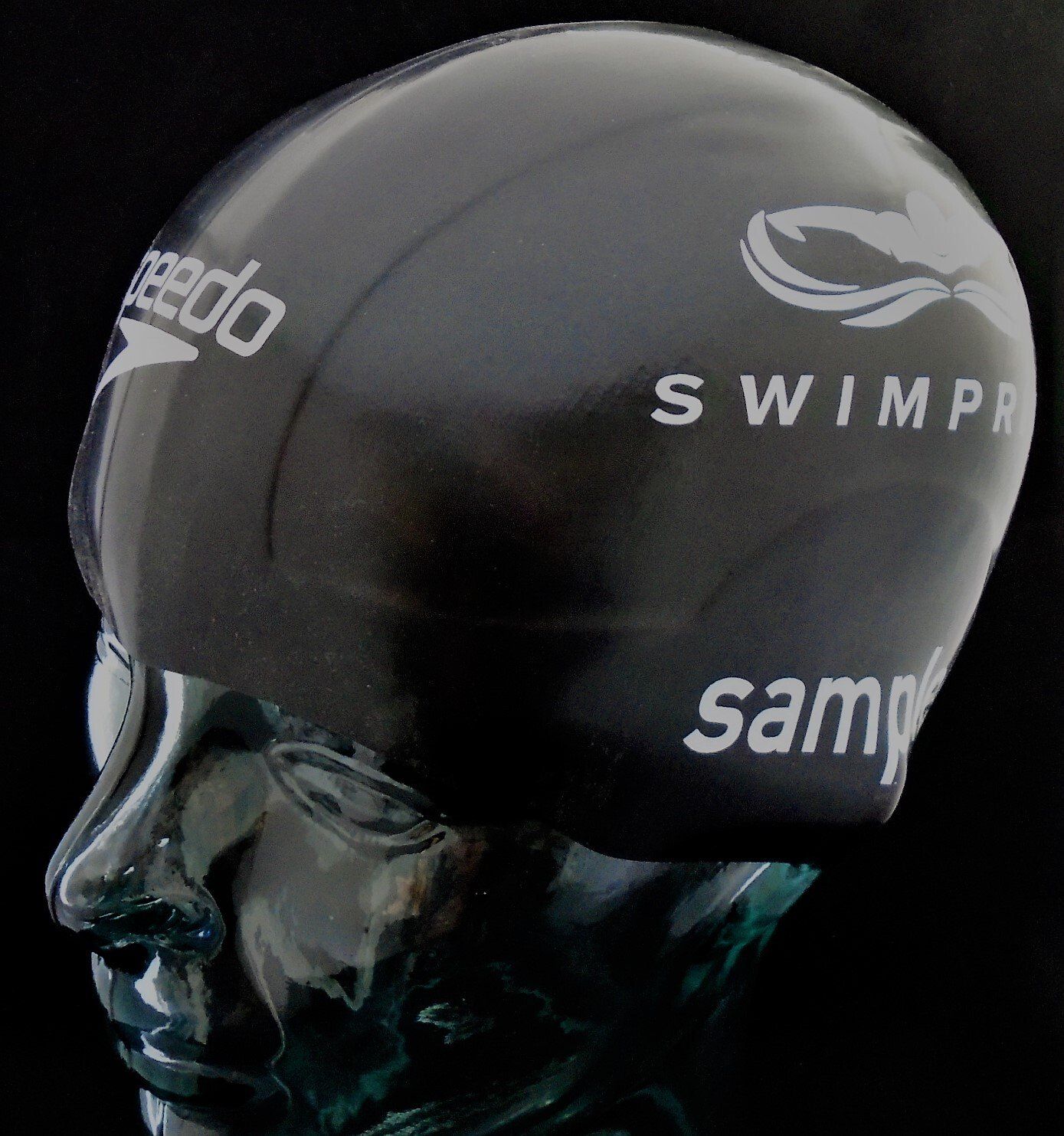 A speedo swim cap is on a mannequin head